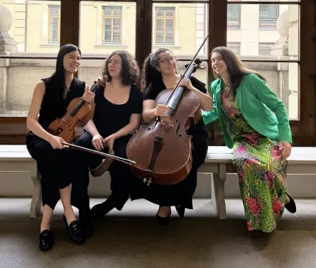man playing the piano in front of open music book